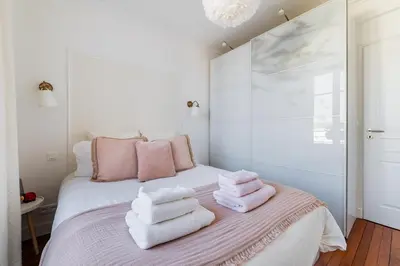 Un ou plusieurs lits dans un hébergement de l'établissement Cerise's home - Cosy flat 15min from Paris with hot tub