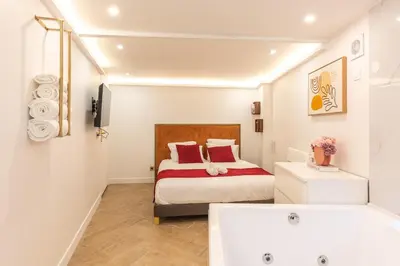 Un ou plusieurs lits dans un hébergement de l'établissement Appartement d'exception avec Jacuzzi et AC - 6P