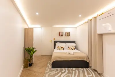 Un ou plusieurs lits dans un hébergement de l'établissement Appartement d'exception avec Jacuzzi et AC - 6P