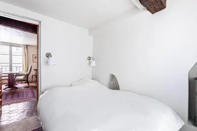 Un ou plusieurs lits dans un hébergement de l'établissement GuestReady - Discover the Charm of Paris