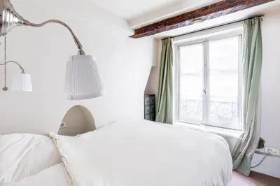 Un ou plusieurs lits dans un hébergement de l'établissement GuestReady - Discover the Charm of Paris