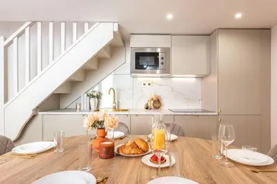 Cuisine ou kitchenette dans l'établissement Appartement Raffiné avec Jacuzzi et AC - 6P