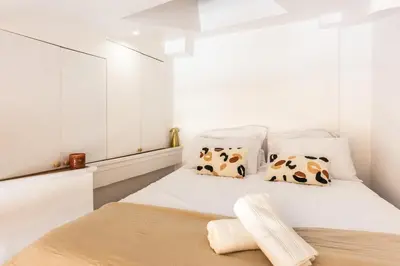Un ou plusieurs lits dans un hébergement de l'établissement Studio élégant esprit Loft avec AC