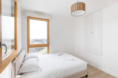 Un ou plusieurs lits dans un hébergement de l'établissement GuestReady - Architect-Designed Retreat near Paris
