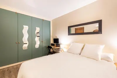 Un ou plusieurs lits dans un hébergement de l'établissement GuestReady - Modern Comfort in the Heart of Paris