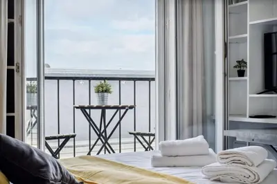Un ou plusieurs lits dans un hébergement de l'établissement Amazing view apartment in heart of Paris