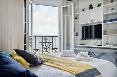 Un ou plusieurs lits dans un hébergement de l'établissement Amazing view apartment in heart of Paris
