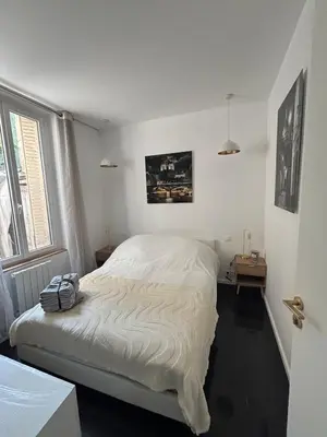 Un ou plusieurs lits dans un hébergement de l'établissement Charming Paris apartment