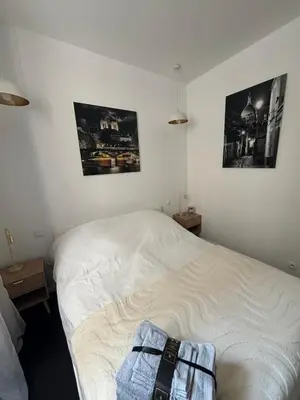 Un ou plusieurs lits dans un hébergement de l'établissement Charming Paris apartment