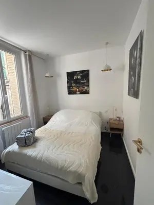 Un ou plusieurs lits dans un hébergement de l'établissement Charming Paris apartment