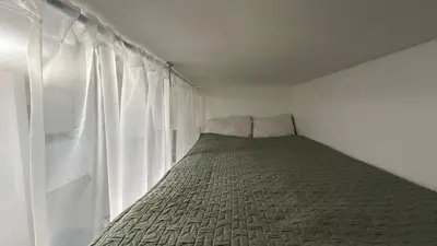 Un ou plusieurs lits dans un hébergement de l'établissement Cozy studio in Paris 15eme