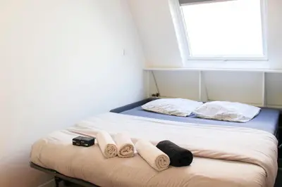 Un ou plusieurs lits dans un hébergement de l'établissement Studio - 2P - Champs Elysées