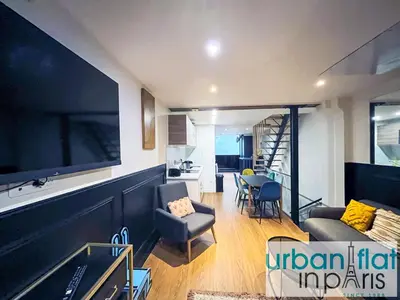 Coin salon dans l'établissement Urban Flat 31 - Lovely Triplex in Paris