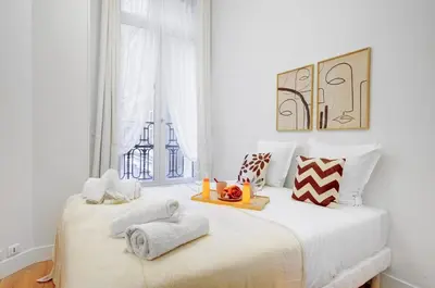 Un ou plusieurs lits dans un hébergement de l'établissement 5013 Kleber Suite - Suite near Arc de Triomphe