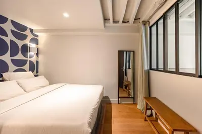 Un ou plusieurs lits dans un hébergement de l'établissement Appartement design et confortable au cœur du Marais