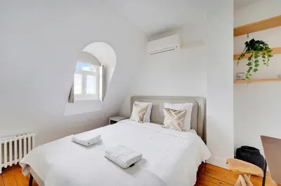 Un ou plusieurs lits dans un hébergement de l'établissement Loft d'exception Courcelles - parc Monceau