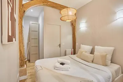 Un ou plusieurs lits dans un hébergement de l'établissement Superb apartment 1 bedroom Center of Paris by Studio Prestige