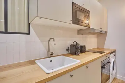 Cuisine ou kitchenette dans l'établissement Superb apartment 1 bedroom Center of Paris by Studio Prestige