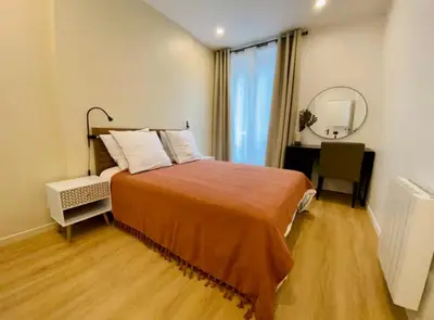 Un ou plusieurs lits dans un hébergement de l'établissement Appartement Tour Eiffel Bir Hakeim