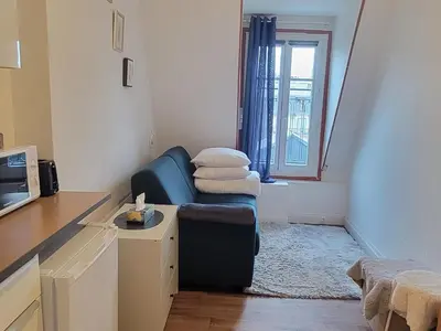Coin salon dans l'établissement Appartement avec vue sur la tour eiffel