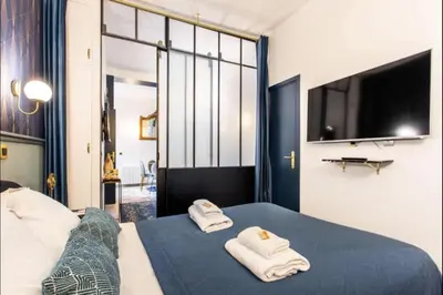 Un ou plusieurs lits dans un hébergement de l'établissement Charming 2BR # Grands Boulevards