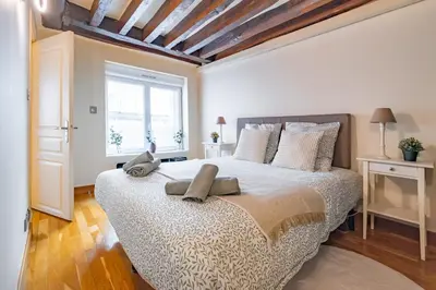 Un ou plusieurs lits dans un hébergement de l'établissement Apt Grands Boulevards 4 Guests