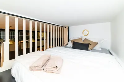 Un ou plusieurs lits dans un hébergement de l'établissement Triplex 50 m2 - Montorgueil & Marais