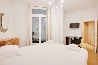 Un ou plusieurs lits dans un hébergement de l'établissement Superb apartment with terrace 2BR 4P Trocadero