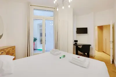Un ou plusieurs lits dans un hébergement de l'établissement Superb apartment with terrace 2BR 4P Trocadero