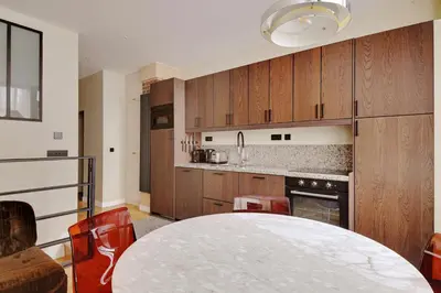 Cuisine ou kitchenette dans l'établissement Pick A Flat's apartment in Monmartre - Rue Etex