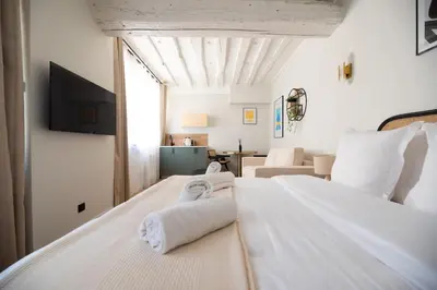 Un ou plusieurs lits dans un hébergement de l'établissement Cosy Studio with Prime Location, Le Marais