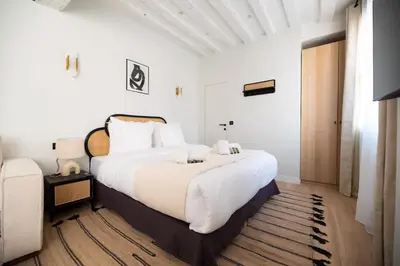 Un ou plusieurs lits dans un hébergement de l'établissement Cosy Studio with Prime Location, Le Marais