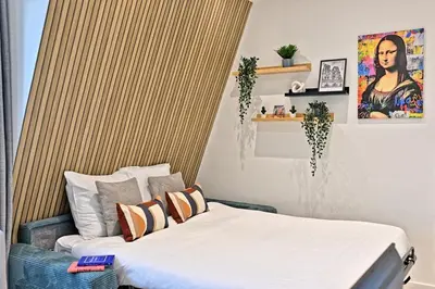 Un ou plusieurs lits dans un hébergement de l'établissement Studio élégant à Neuilly entre Paris et La Défense