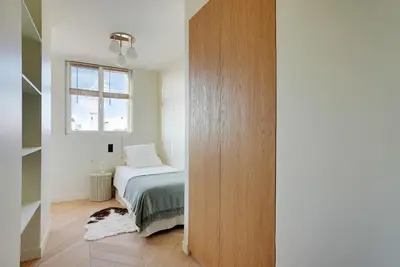 Un ou plusieurs lits dans un hébergement de l'établissement Riverside Chic Loft