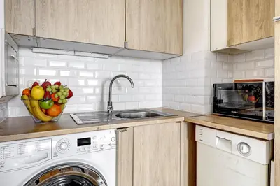 Cuisine ou kitchenette dans l'établissement 5019 Suite Pouey - Apartment near La Défense