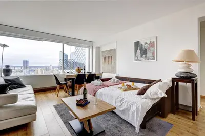 Coin salon dans l'établissement 5019 Suite Pouey - Apartment near La Défense