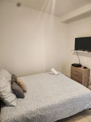 Un ou plusieurs lits dans un hébergement de l'établissement Maison studio