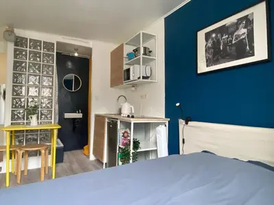 Un ou plusieurs lits dans un hébergement de l'établissement Beautiful Studio