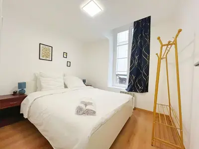 Un ou plusieurs lits dans un hébergement de l'établissement Apartment Le Marais