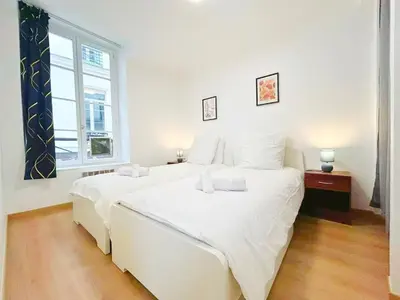 Un ou plusieurs lits dans un hébergement de l'établissement Apartment Le Marais