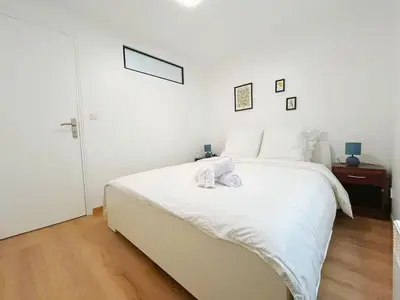 Un ou plusieurs lits dans un hébergement de l'établissement Apartment Le Marais