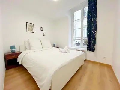 Un ou plusieurs lits dans un hébergement de l'établissement Apartment Le Marais