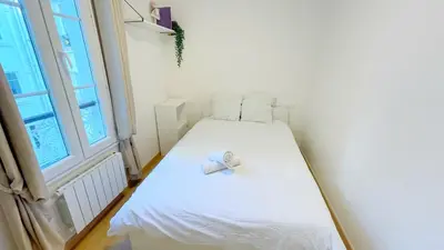 Un ou plusieurs lits dans un hébergement de l'établissement Cozy Ap des Gobelins
