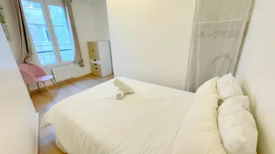 Un ou plusieurs lits dans un hébergement de l'établissement Cozy Ap des Gobelins