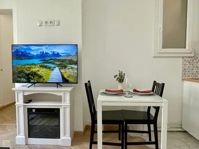 Télévision ou salle de divertissement dans l'établissement Appartement Convention Maridor 3