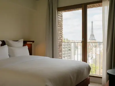 Un ou plusieurs lits dans un hébergement de l'établissement Edgar Suites - Église