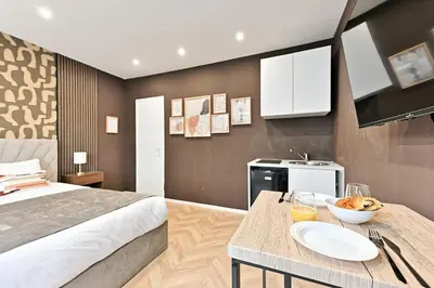 Un ou plusieurs lits dans un hébergement de l'établissement Studio Élégant Paris - Père Lachaise