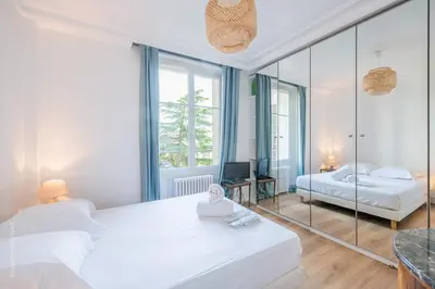 Un ou plusieurs lits dans un hébergement de l'établissement Appartement - Roland-Garros & Parc des Princes