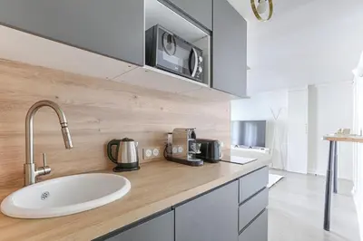 Cuisine ou kitchenette dans l'établissement Appartement de Charme rue Lafayette 4P-1BR