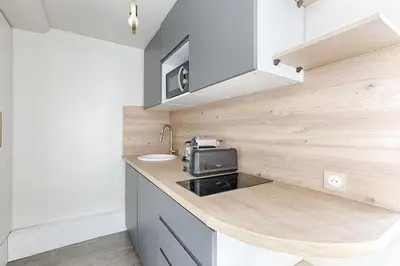 Cuisine ou kitchenette dans l'établissement Appartement de Charme rue Lafayette 4P-1BR